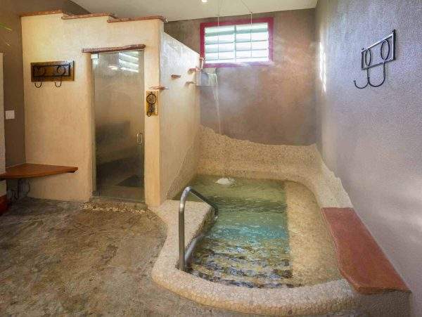 The Wet Room - hot mineral water soaking pool with steam room and waterfalls at Blackstone Hotsprings